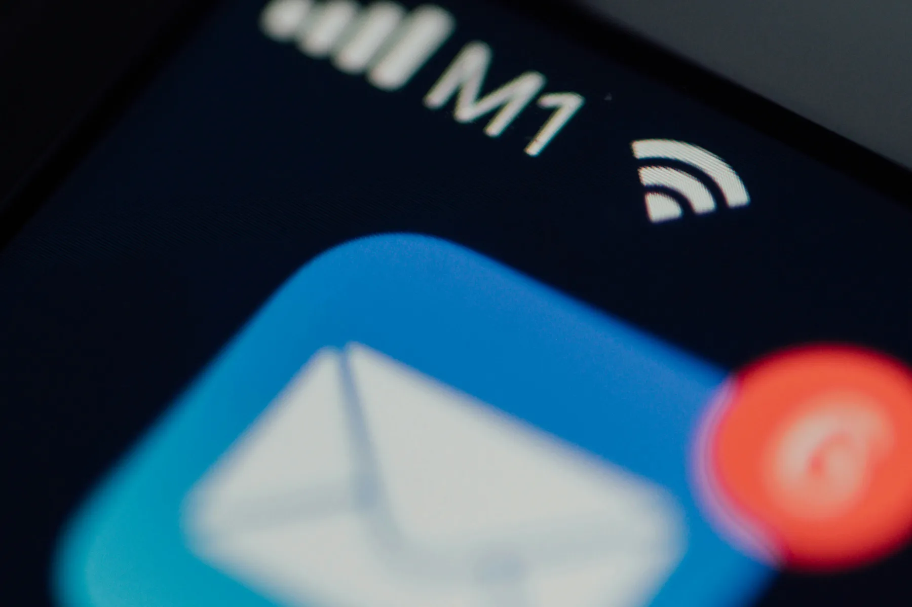 Close-up of a phone's Mail app icon with a red notification badge showing two unread messages